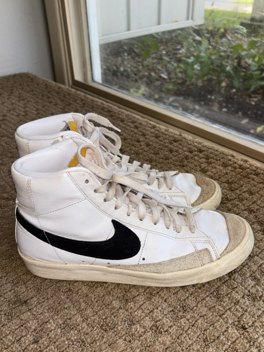 Nike blazers Womenβs 9.5 White High-Top Sneakers with Black Swoosh